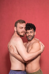 Fototapeta na wymiar calm and serene, two men gay couple posing to camera shirtless.