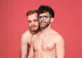gay couple shirtless, upper body.