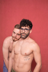 Fototapeta na wymiar possessive gay couple, two men close together.