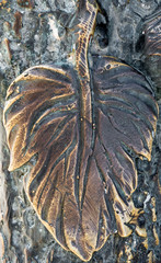 Forged product in the form of a grape leaf. close-up.