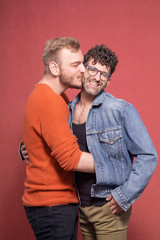 gay couple, hugging and together while being happy.