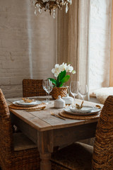 White plate and golden fork with a spoon, appliances for frying, wedding decoration. Christmas or tanksgiving dinner. From above