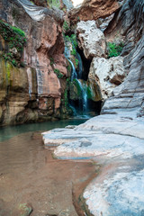 Fresh water cascading down falls and accumulating in small crystal clear pools, Elves Chasm, Grand Canyon National Park, Arizona