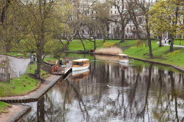 Passenger boats on the river in the city of Riga