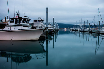 Fototapeta premium Fishing and tour boats in Resurrection Bay getting ready for the day.
