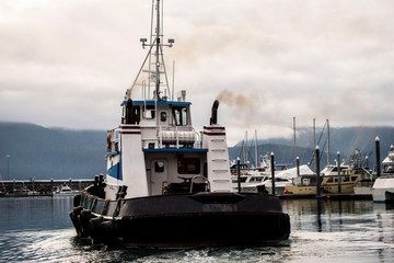 Fototapeta premium Fishing and tour boats in Resurrection Bay getting ready for the day.