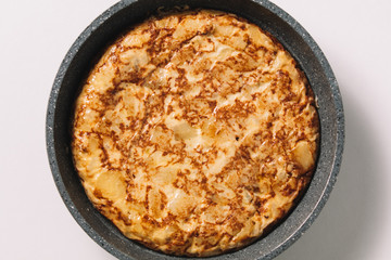 tortilla de patatas on white background, typical spanish dish