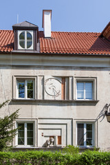 Sundial on the wall in the old town of Warsaw