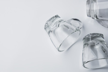 Drinking glass on white floor