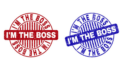 Grunge I'M THE BOSS round stamp seals isolated on a white background. Round seals with grunge texture in red and blue colors.