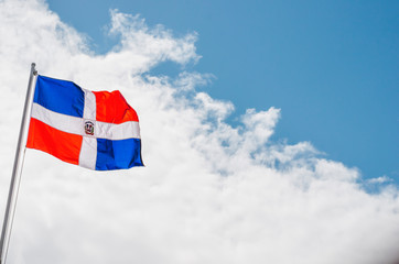 image of the Dominican Republic flag with blue sky