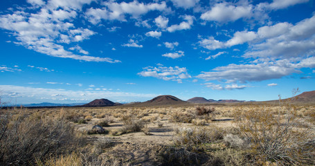 Fototapeta na wymiar Old volcanios are the feature of this desert landscape in the Mojave desert. 