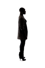 Black female African American model silhouette on a white background.  She is posed standing or waiting in side view.