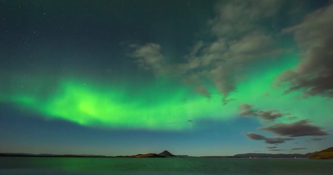 Timelapse of northern lights with beautiful landscape in view