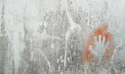 Dirty white wall with a hand stamp for the concept of independence or freedom