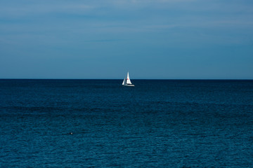 Obraz premium View of a sailboat in the Mediterranean sea. Barcelona, Spain