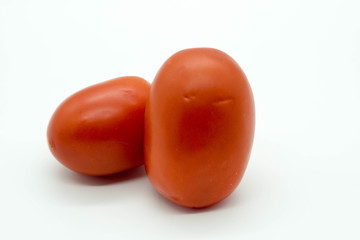 two tomatoes isolated on white background