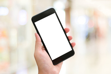 Hand using smart phone with blank screen over blur bokeh light background, business and technology, internet of things concept