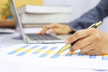 hand businesswomen are typing on computers to find current online trading trends.