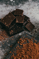 black chocolate and cocoa powder lie beautifully on the table