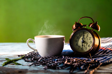 Green background with antique gold alarm clock