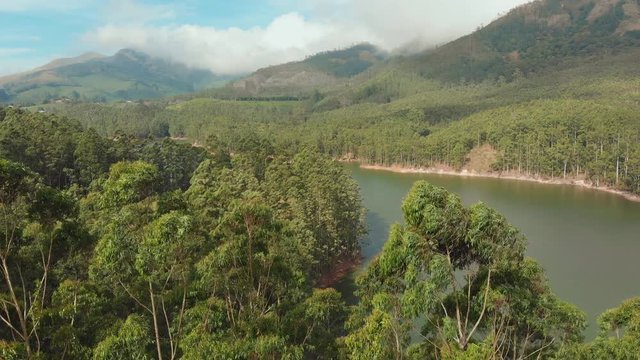 Aerial view beautiful nature with mountains and hills by Lake Mattupetty. Kerala State. Near the city of Munar.