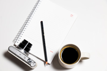 Top view coffee and camera notebook on Flat lay