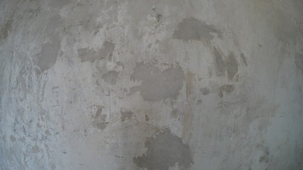 Old concrete wall for background, gray concrete with dark patches