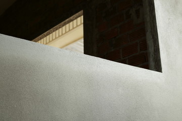 window frame on cement wall inside construction site building industry