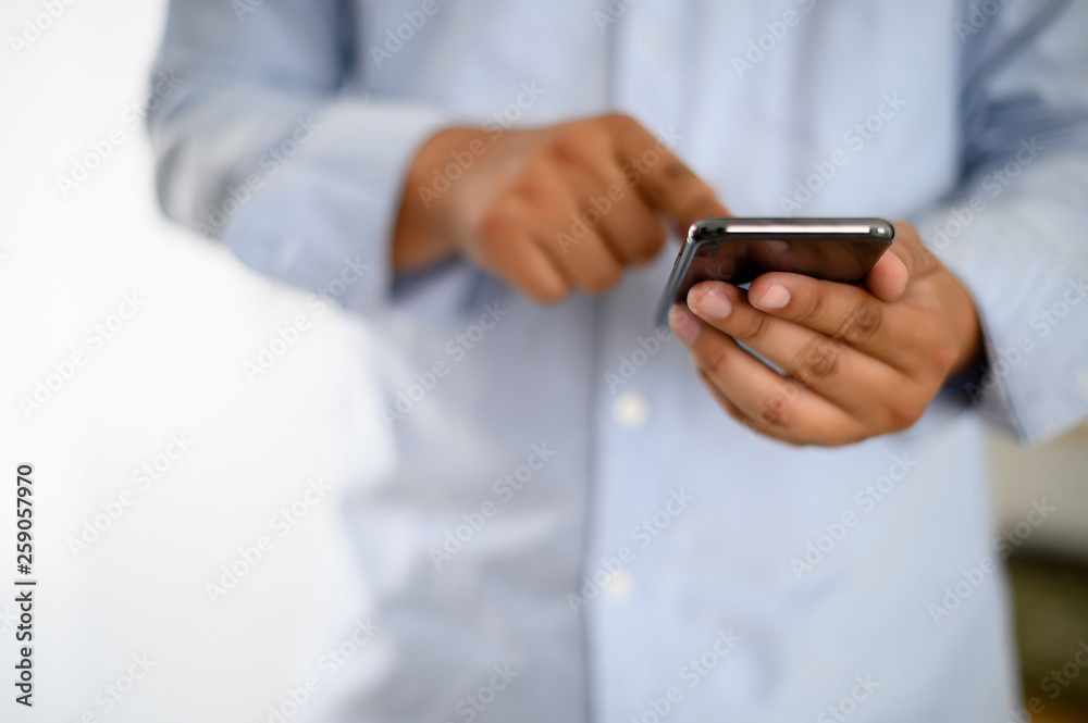 Poster manhands using a smartphone text work digital and communication concept