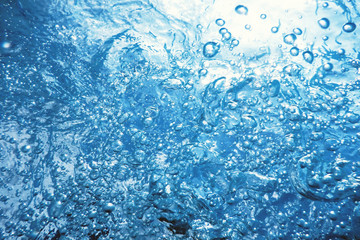 Underwater bubbles with sunlight. Underwater background bubbles.