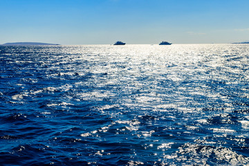 White yachts on the horizon at Red sea