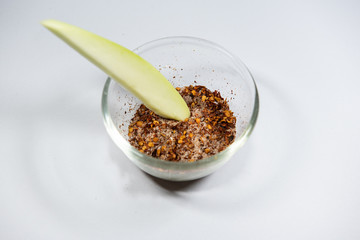 Thailand snack traditional ,Raw mango with salt and chile pepper sauce on white plate.