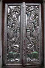 Chiang Mai Thailand, carved silver doors in lanna style