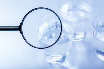 Plastic cup with water on table. Environmental problem concept