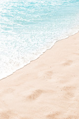 Blue ocean wave on sandy beach. Summer day and sand beach background