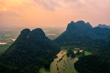 Aerial drone photo - Mountains and lakes of northern Vietnam at sunset.   © nick