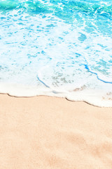 Fototapeta na wymiar Blue ocean wave on sandy beach. Summer day and sand beach background