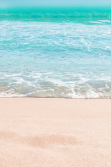 Soft wave of blue ocean on sandy beach. Summer Background. Copyspace