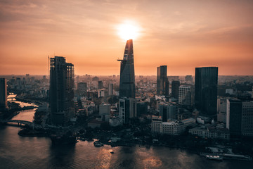 Fototapeta premium Aerial drone photo - Skyline of Saigon (Ho Chi Minh City) at sunset. Vietnam