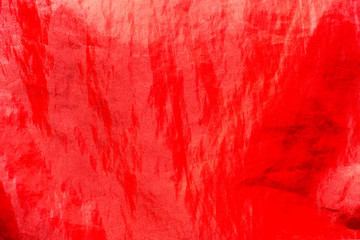 Dry Polyester Tote Bag in the sun, Red glossy texture backgroud, Close up & macro shot, Sport  bag concept