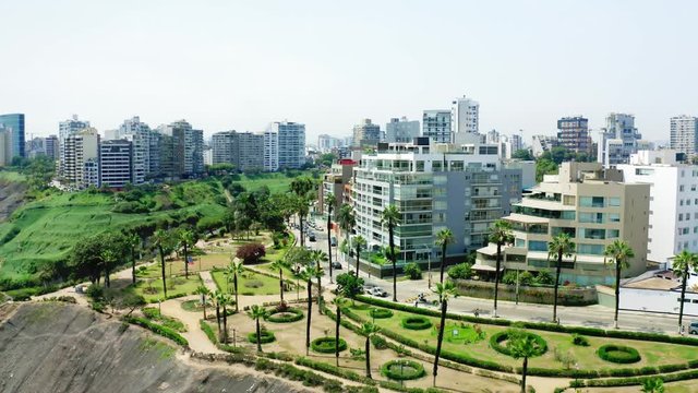 Lima, Per&uacute; - March 27 2019: Aerial view of Paul Harris Malecon in Barranco district, luxury buildings and apartments at Costa Verde in Lima, Peru. View of the cliff, the highway and the ocean.
