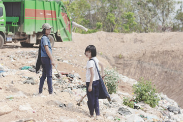 Stop garbage disposal. World Environment Day, Poor children collect garbage for sale because of poverty, Junk recycle, Child labor, Poverty concept,
