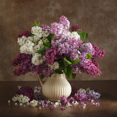 Still life lilac flowers in a vase on the table