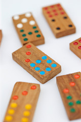 Wooden domino pieces on white background
