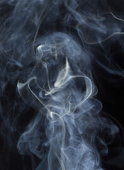 Abstract white smoke on black background