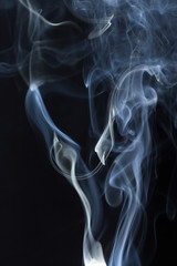 Abstract white smoke on black background
