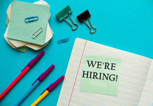 "WE ARE HIRING" CONCEPT. Office workplace top view, copy space.Flat lay office table desk.Labor market concept. Job vacancy,new recruitment, trainee, occupation.Job recruiting advertisement represent.