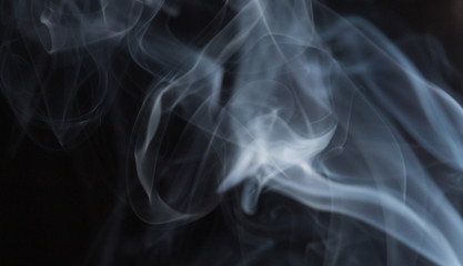 Abstract white smoke on black background