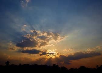 sun rays are striking through the clouds